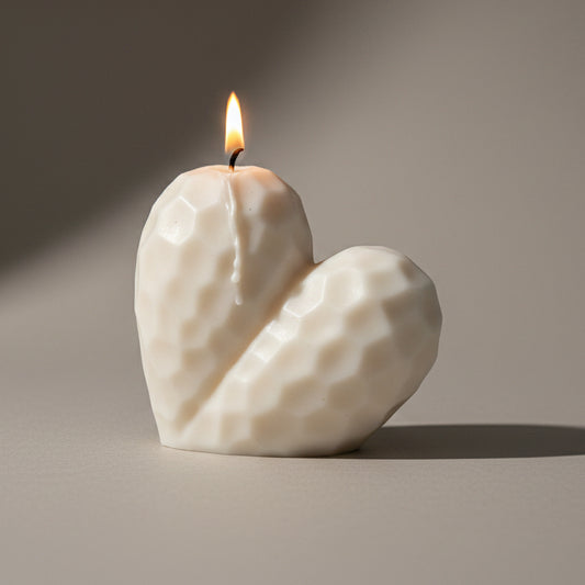 Hand-poured burning Sculptural Heart pillar candle in soy and beeswax blend by Quality Time Candles, inspired by naturally-formed shapes