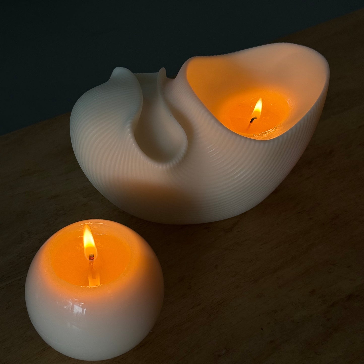 Hand-poured Sculptural Shell pillar burning candle in soy and beeswax blend by Quality Time Candles, inspired by coastal wind-formed shapes