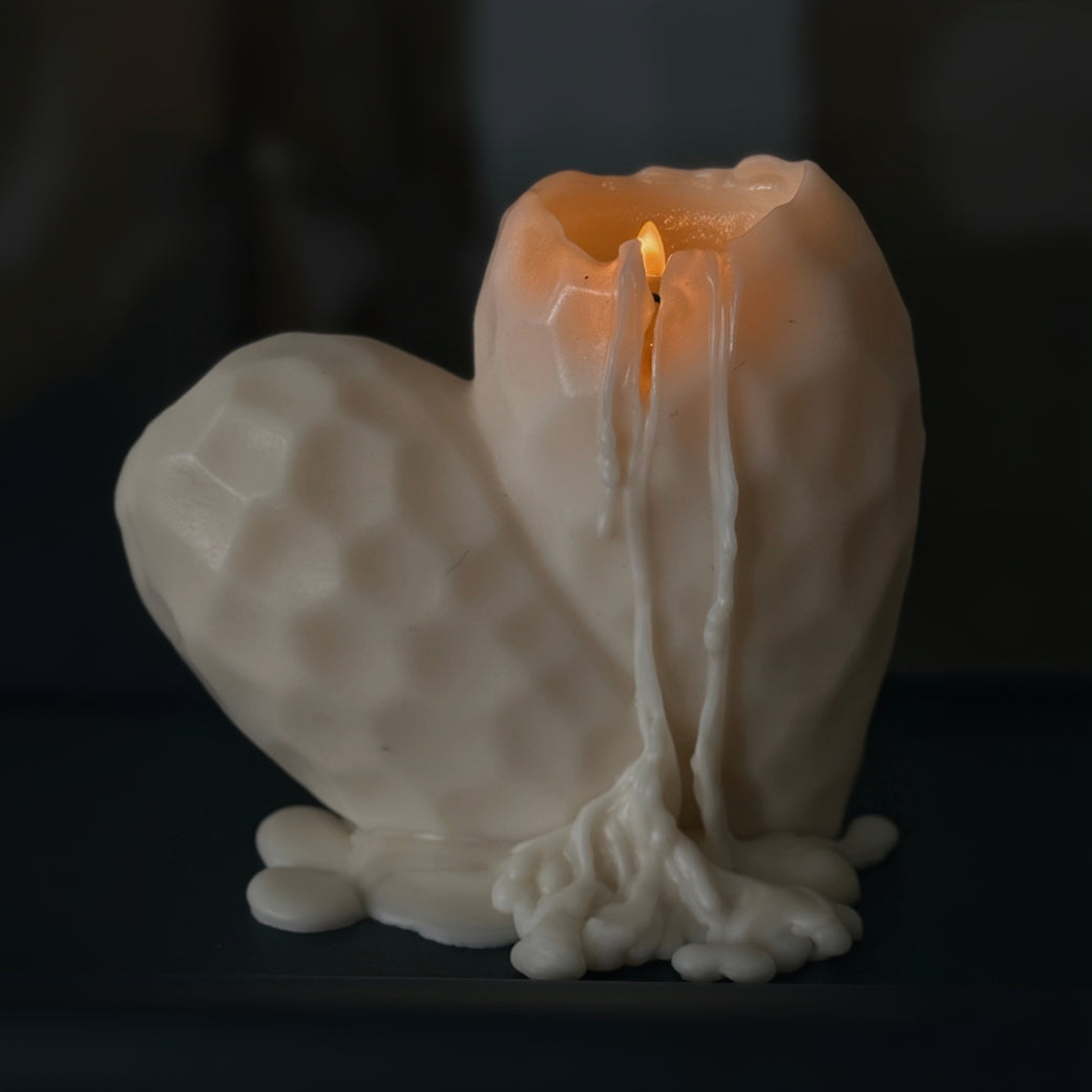 Hand-poured burning Sculptural Heart pillar candle in soy and beeswax blend by Quality Time Candles, inspired by naturally-formed shapes