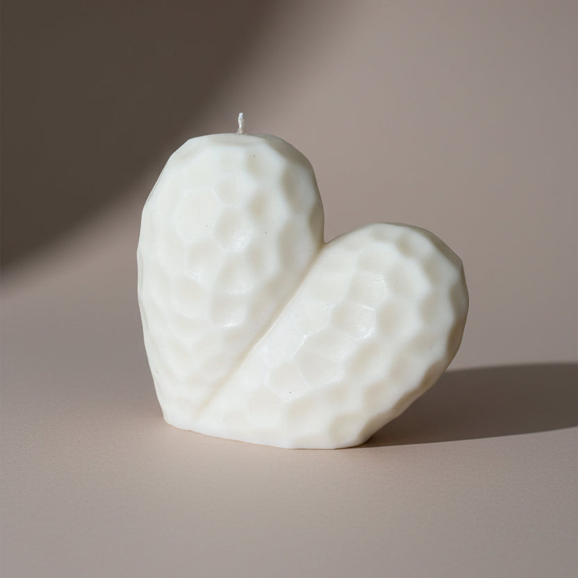 Hand-poured Sculptural Heart pillar candle in soy and beeswax blend by Quality Time Candles, inspired by naturally-formed shapes
