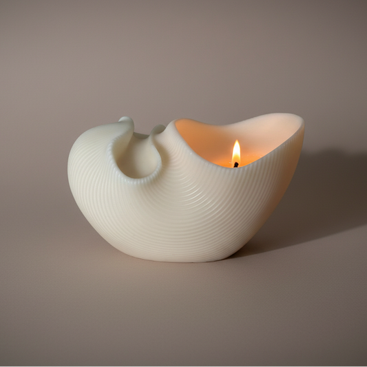 Hand-poured Sculptural Shell pillar burning candle in soy and beeswax blend by Quality Time Candles, inspired by coastal wind-formed shapes