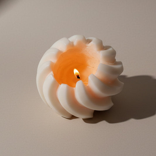 Hand-poured burning Sculptural twirl-swirl-sand dune candle in soy and beeswax blend by Quality Time Candles, inspired by naturally-formed shapes